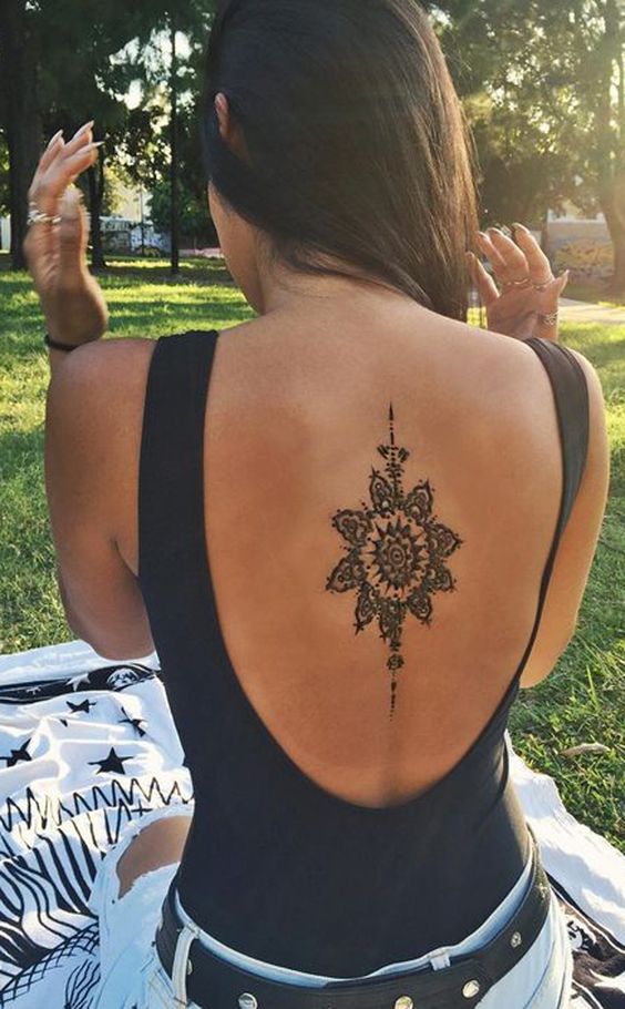Geometric Mandala Sun Spine Back Tattoo Ideas at MyBodiArt.com -  ideas geométricas del tatuaje para mujeres con significado