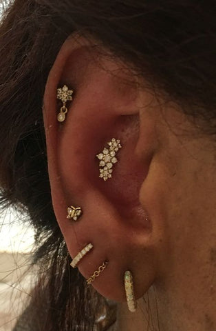50+ Beautiful Flower Ear Piercing Ideas for Cartilage Earring, Conch Piercing, Ear Lobe Earrings at MyBodiArt