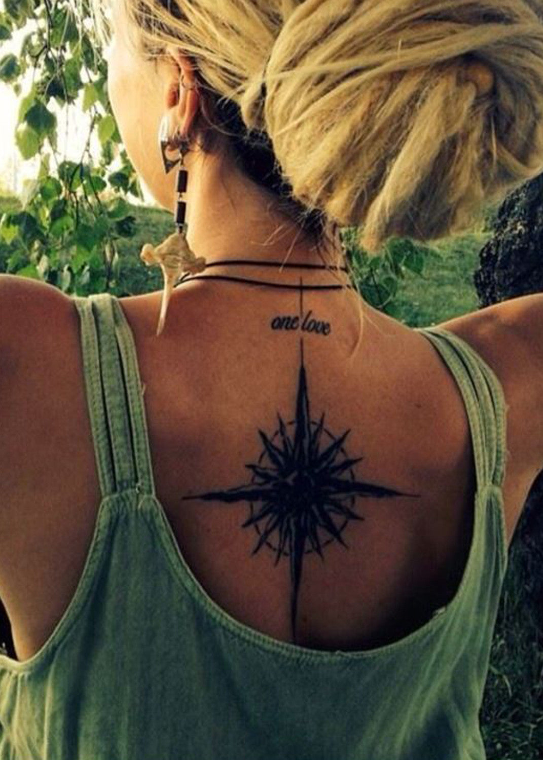 Sun Star Compass Back Spine Tattoo Ideas for Women at MyBodiArt.com