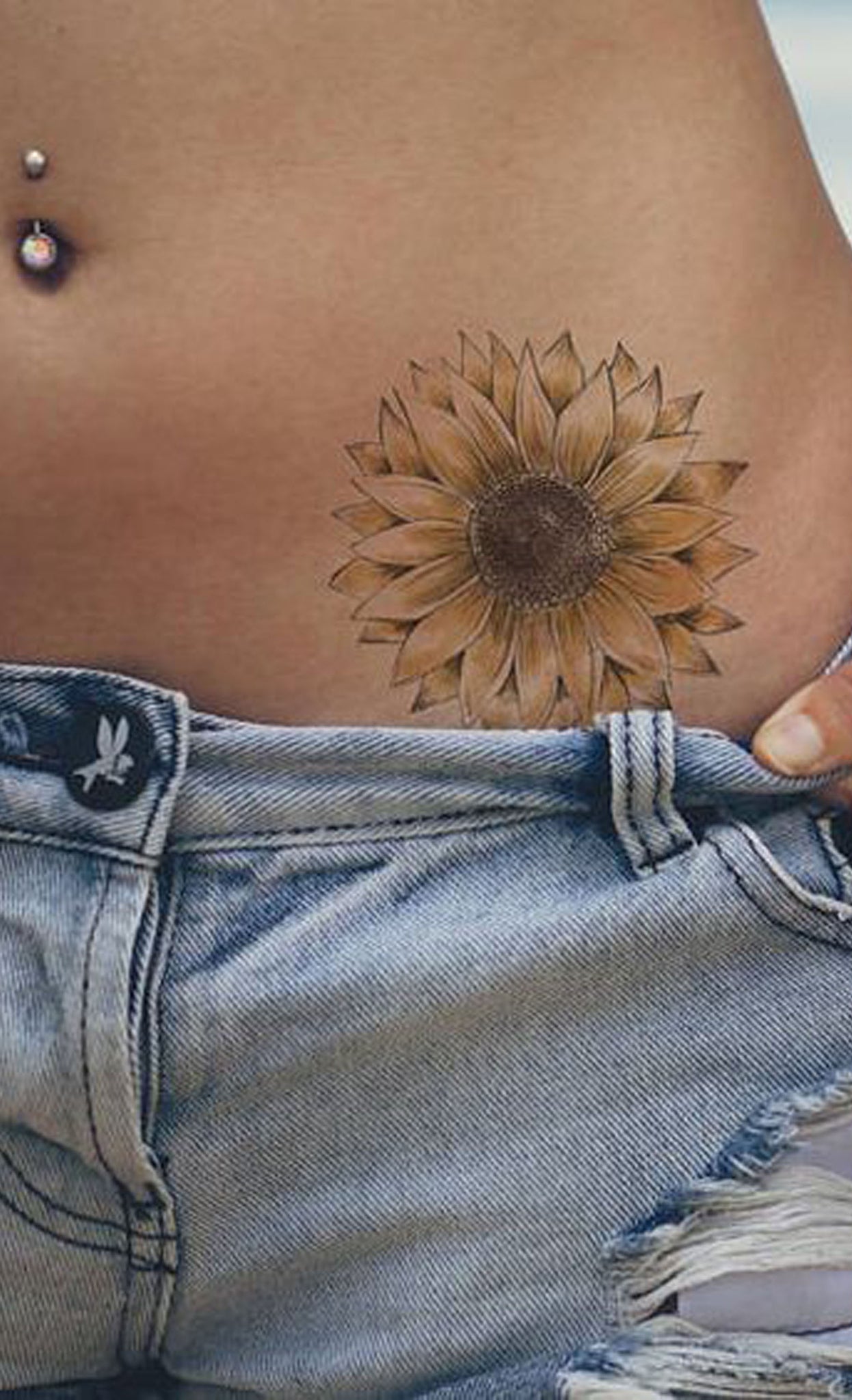 Delicate Sunflower Hip Tattoo Ideas for Women - Beautiful Flower Hip Tat - www.MyBodiArt.com #tattoos