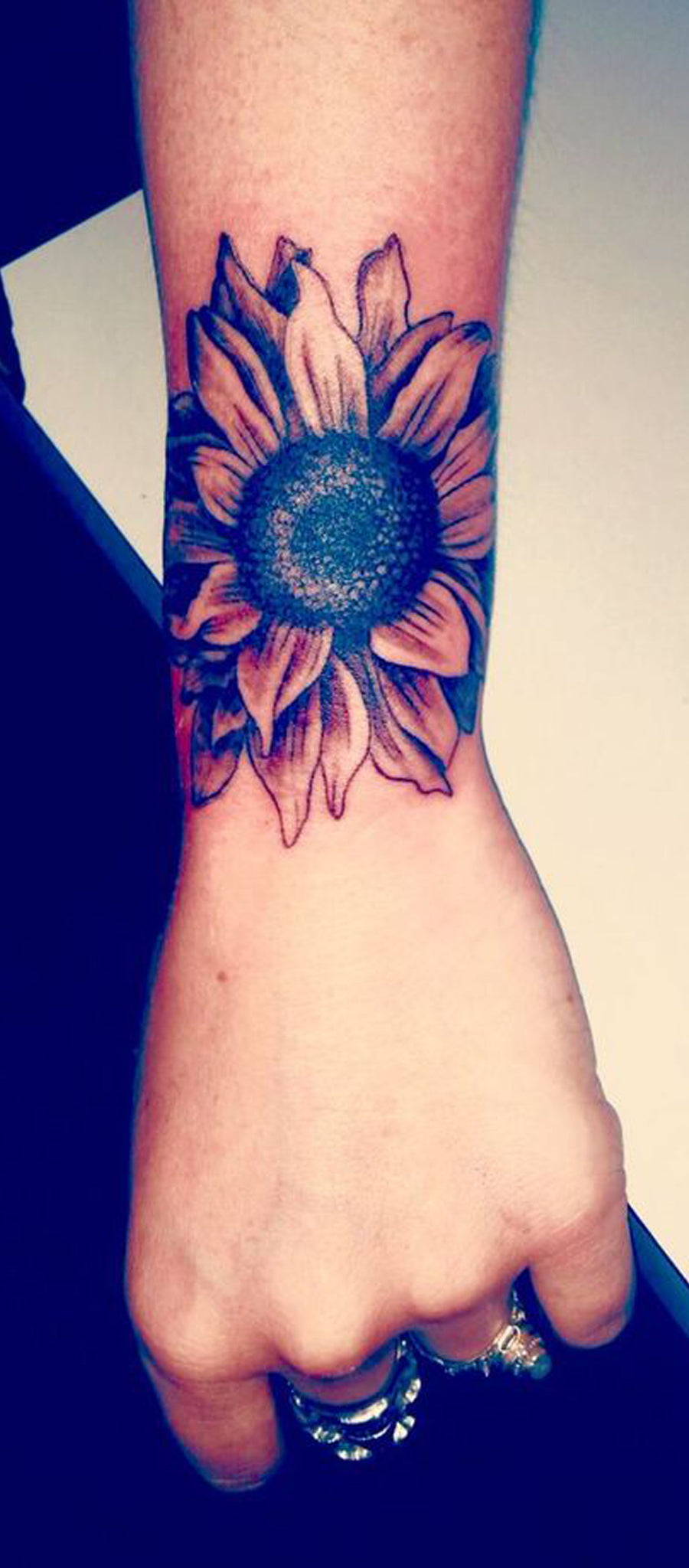 Daisy bouquet with stems and with a sunflower tattoo idea | TattoosAI
