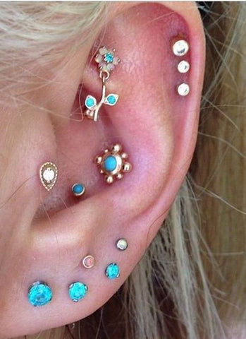 Cute Multiple Ear Piercings in Blue Opal at MyBodiArt