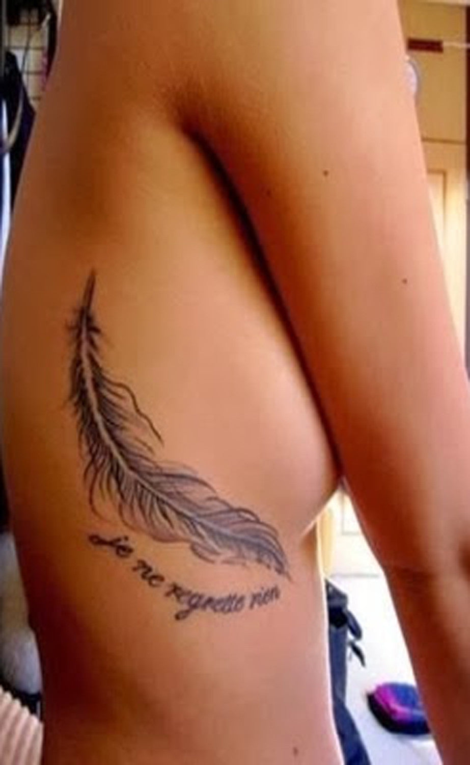 Feather Quote Rib and Back Tattoo Ideas for Women at MyBodiArt.com