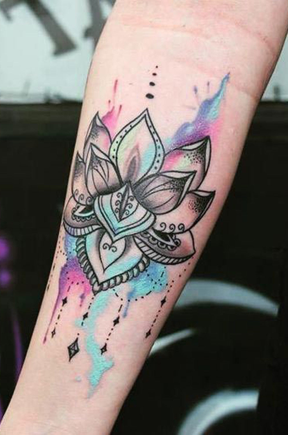 Watercolor Lotus Flower Wrist Tattoo Ideas for Women at MyBodiArt.com