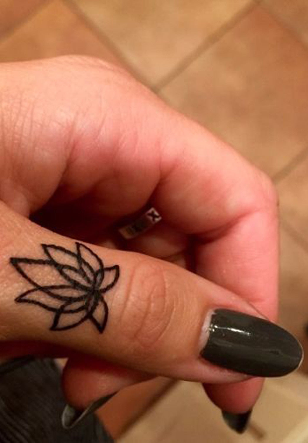 Simple Lotus Finger Tattoo Ideas at MyBodiArt.com - Mandala Flower Hand Tat Placement Thumb