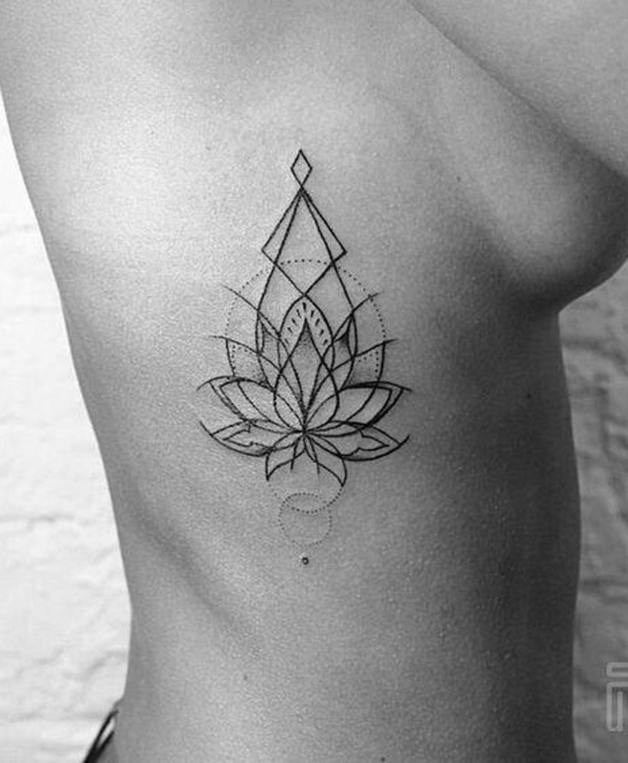 Geometric Simple Lotus Flower Rib Tattoo Placement Ideas for Women - Side Tat - MyBodiArt.com 