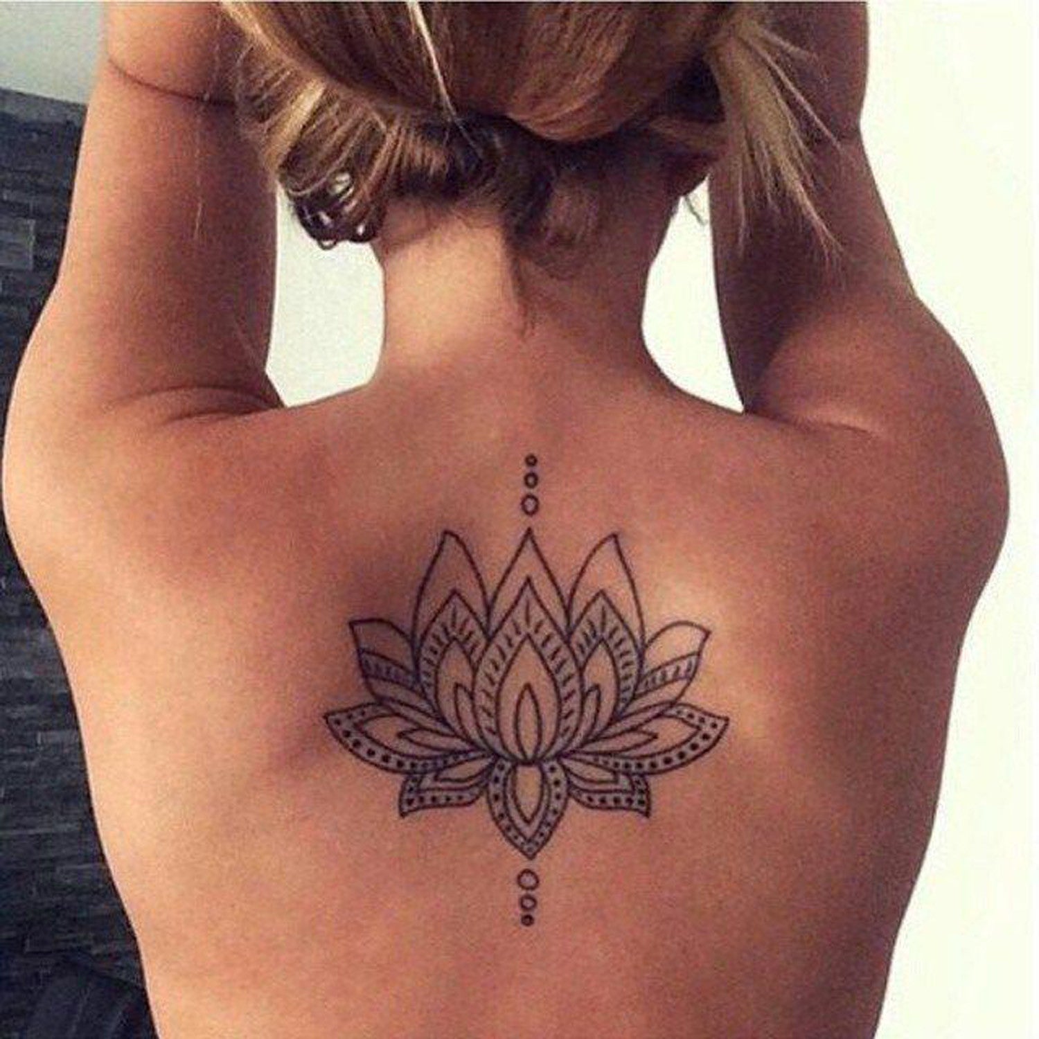 Lotus Floral Flower Upper Back Spine Tattoo Ideas for Women at MyBodiArt.com