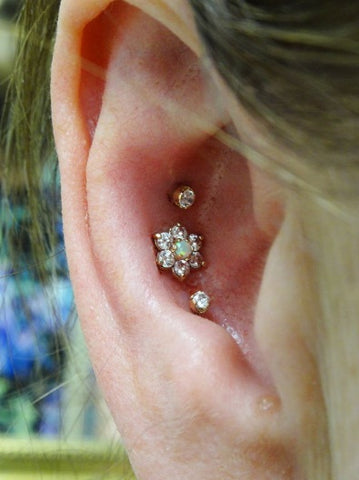 Triple Crystal Flower Conch Piercing Jewelry at MyBodiArt
