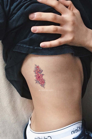 Natural-Looking Flower Rib Tattoo