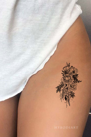 Minimalist Black Flower Thigh Tattoo