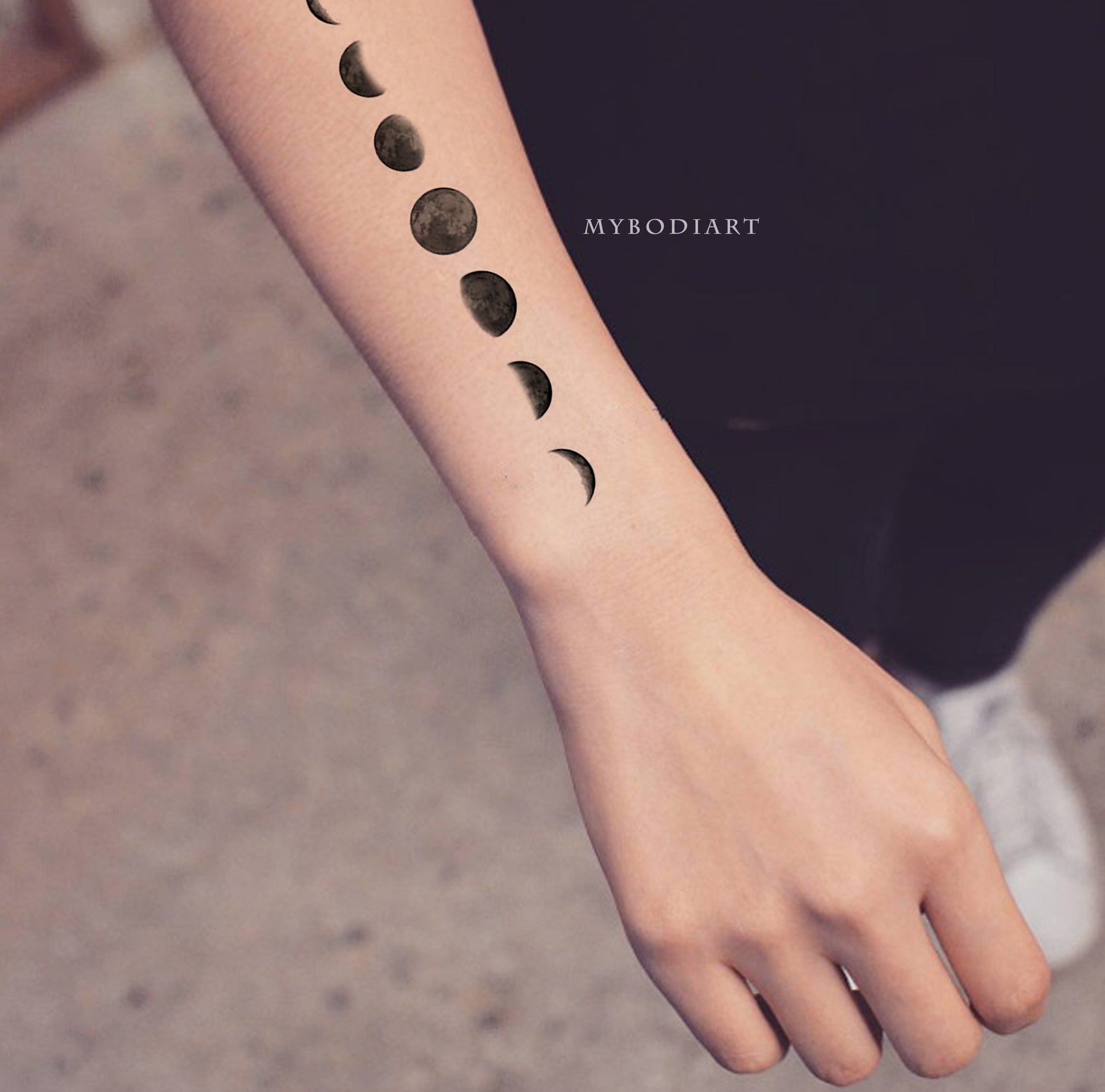 phases of the moon wrist tattoo