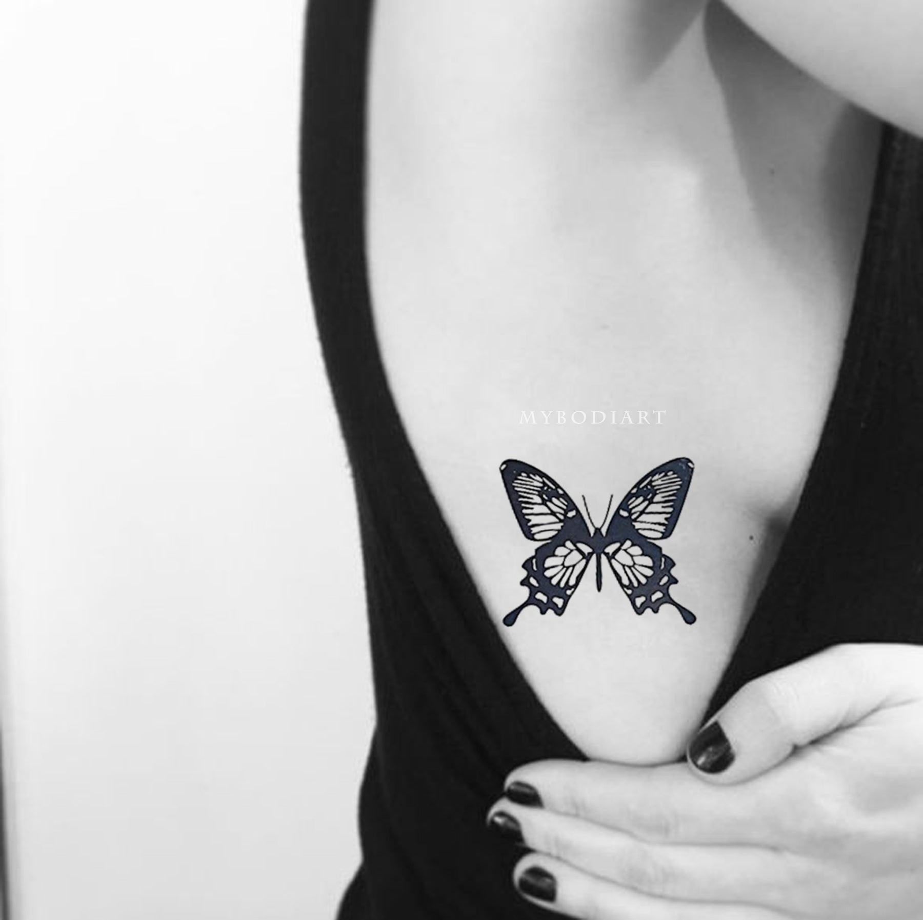 Fine line butterfly couple tattoo on the rib