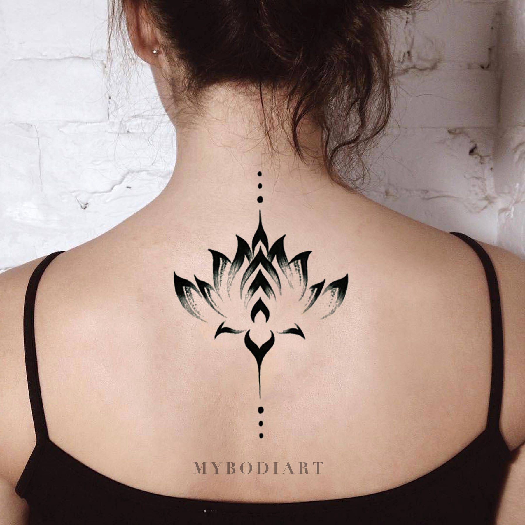 Floral ornament tattoo on the back