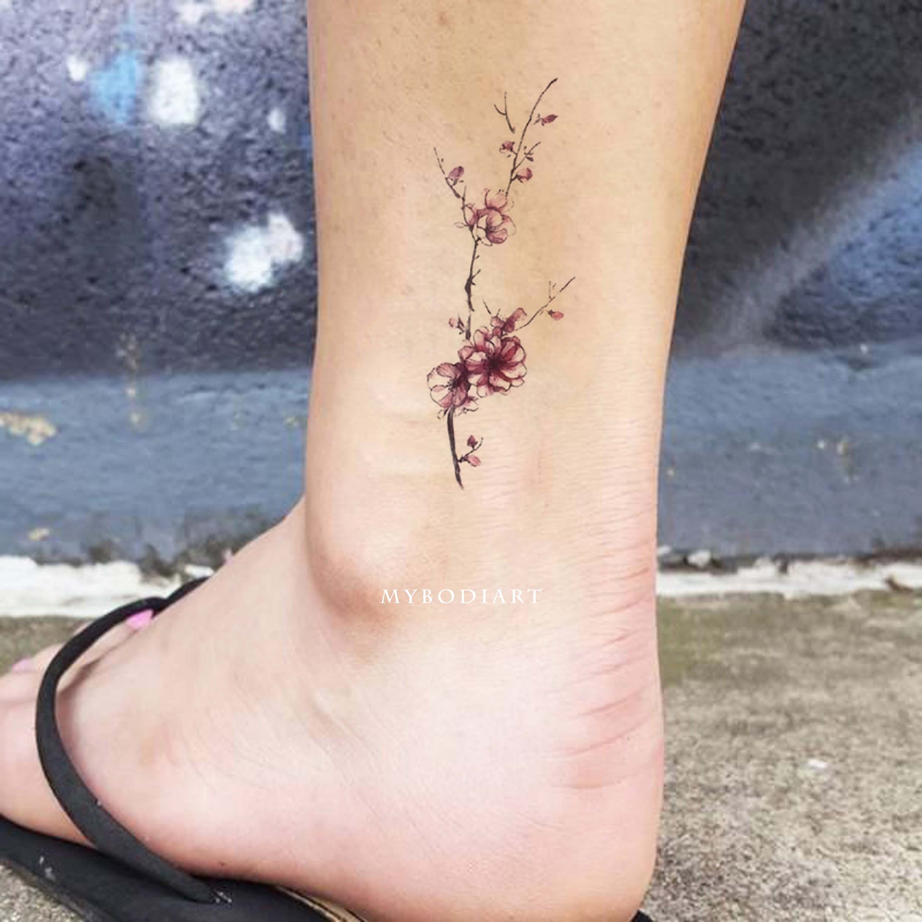 SKIN MACHINE TATTOO STUDIO on Instagram Cherry blossom Anklet tattoo done  by Naina jain Chandani nainstattoos skinmachinetattoo Email for  appointments