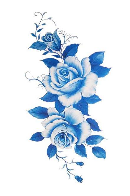 Blue dahlia flower tattooed on the inner arm