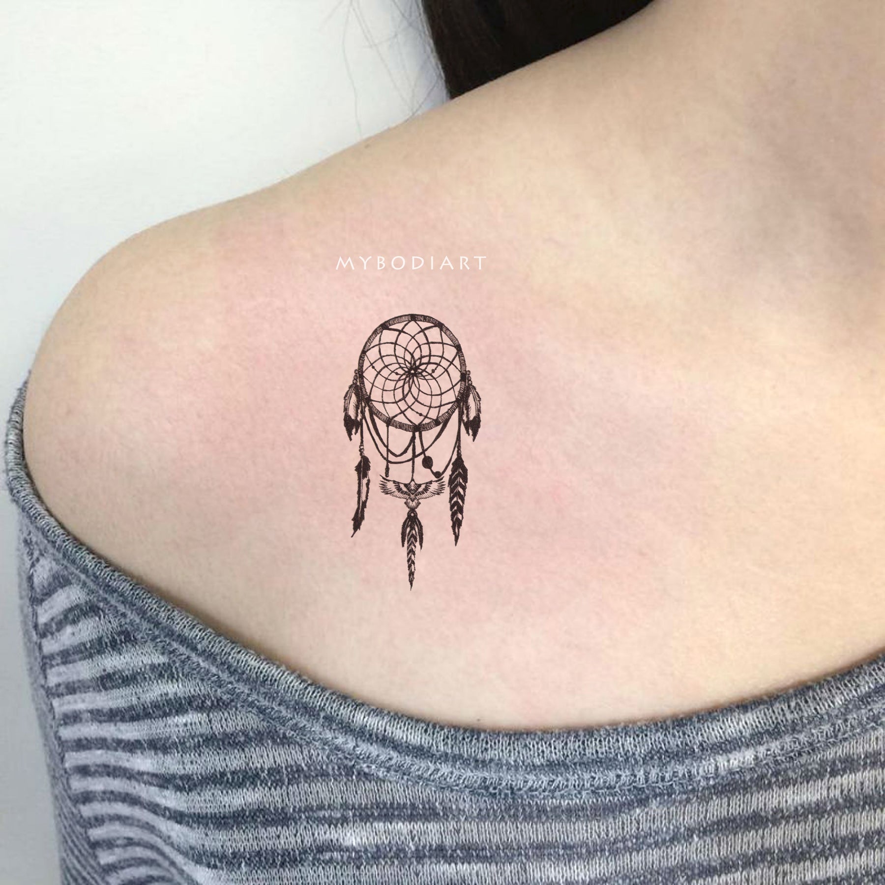 Black and grey dreamcatcher tattoo done on the shoulder