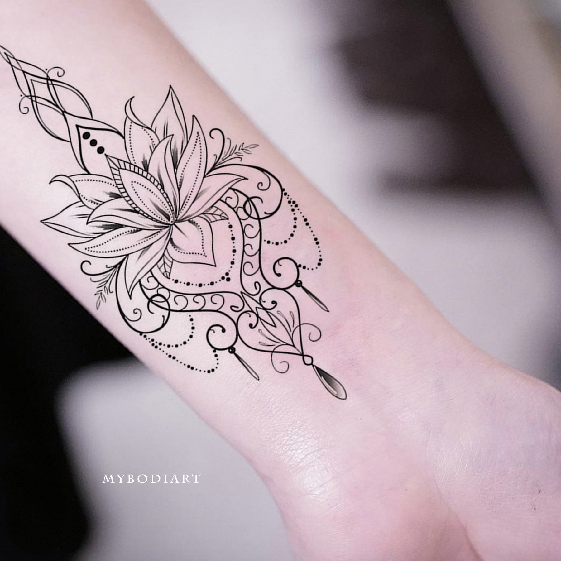 tribal lotus flower tattoo wrist