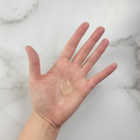 A dollop of petroleum jelly in the palm of a person's hand