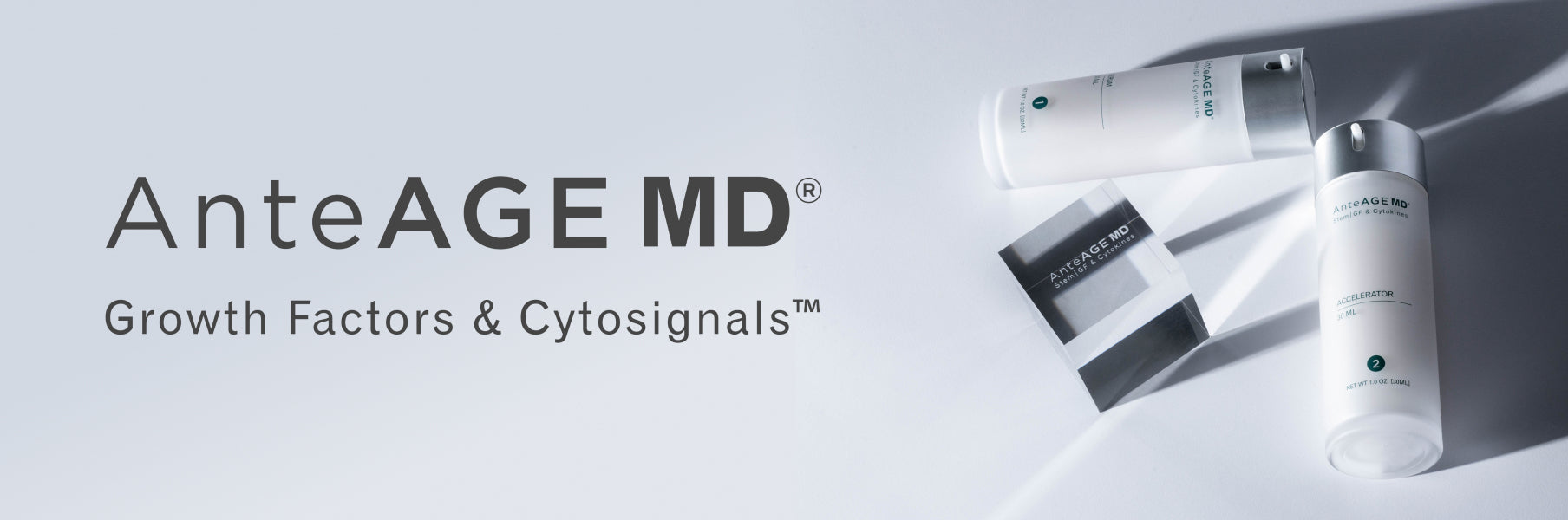 The AnteAGE MD System laying on a pale grey background with a glass cube engraved with "AnteAGE MD Stem | GF & Cytokines", along with the AnteAGE MD logo
