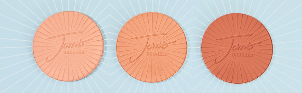 All 3 colors of the new jane iredale PureBronze Matte Bronzer, against a light blue background.