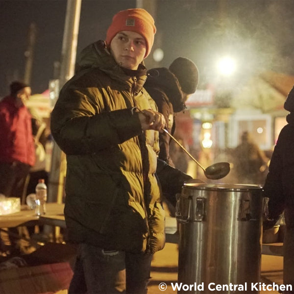 Man serving soup in Ukraine