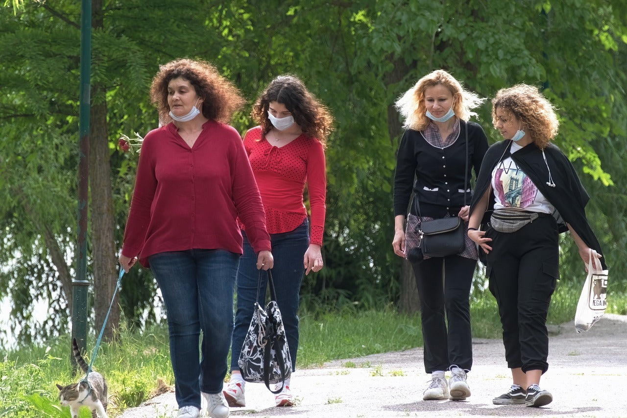 ladies walking a cat