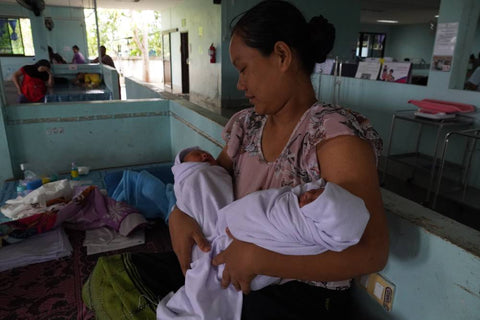 New mother and her daughters at Mae Tao Clinic