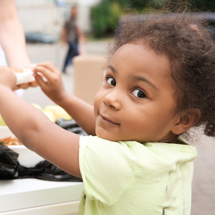 Girl reaching for food