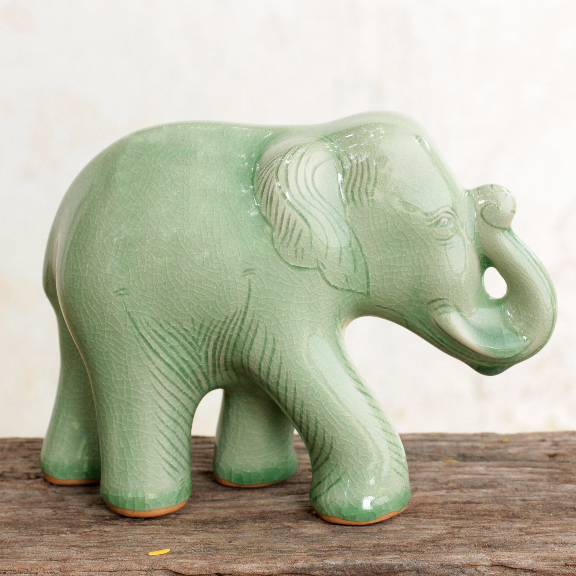 NOVICA Smiling Elephant Celadon Ceramic Happy Elephant Figurine By Thai Artisans