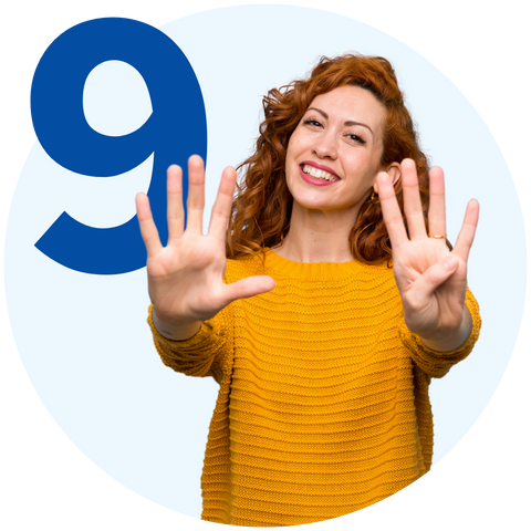 woman holding up nine fingers and the number