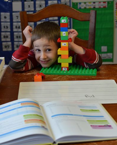 Child engaged in a playful Foundations lesson.