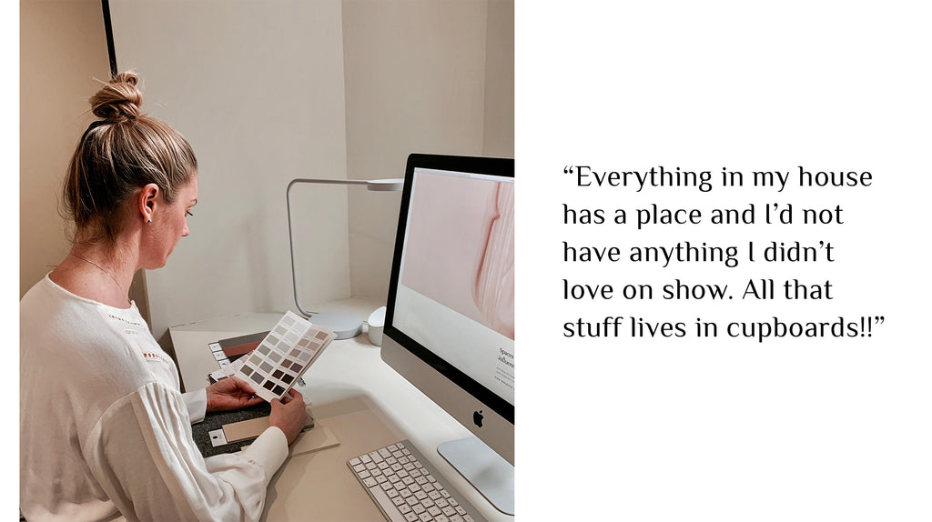 Designer choosing paint colours  in front of an apple imac with her quotation on the right