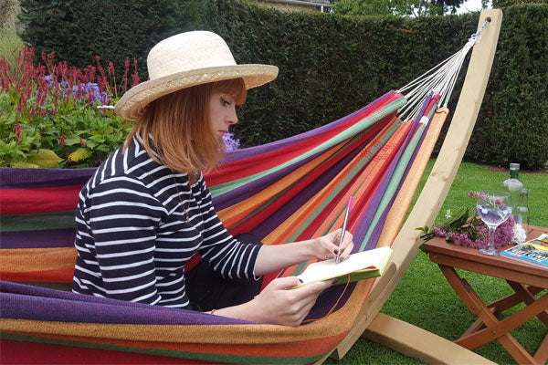 Woman writing in Amazonas Lambada Hammock Tropical