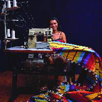 Woman attaching ropes to hammock fabric