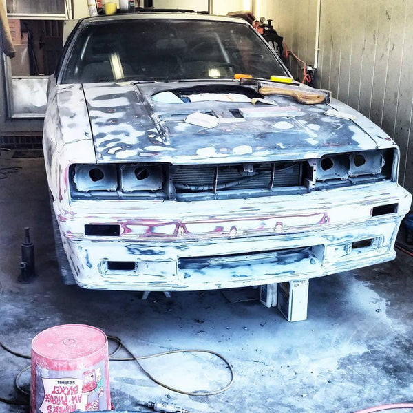 Johnny Detamore built his 1985 Mustang into his coupri, a capri bumper, fenders and rear quarters, Xenon air dam, sn95 interior, custom wheels, IRS rear, blown 2v stroker using a procharger, added t-tops and painted it grabber blue.