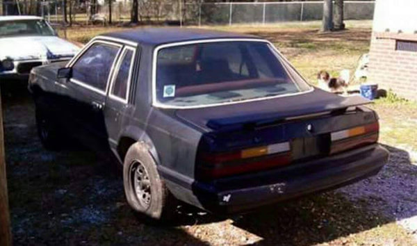 Johnny Detamore built his 1985 Mustang into his coupri, a capri bumper, fenders and rear quarters, Xenon air dam, sn95 interior, custom wheels, IRS rear, blown 2v stroker using a procharger, added t-tops and painted it grabber blue.