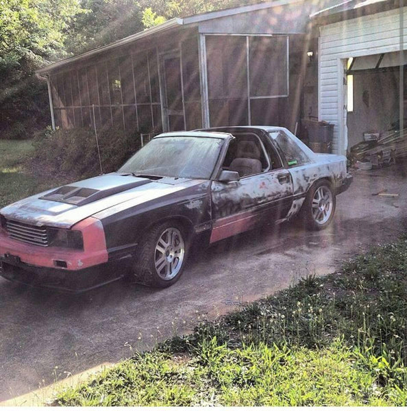 Johnny Detamore built his 1985 Mustang into his coupri, a capri bumper, fenders and rear quarters, Xenon air dam, sn95 interior, custom wheels, IRS rear, blown 2v stroker using a procharger, added t-tops and painted it grabber blue.