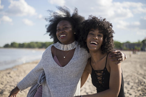 Black women having fun at the beach