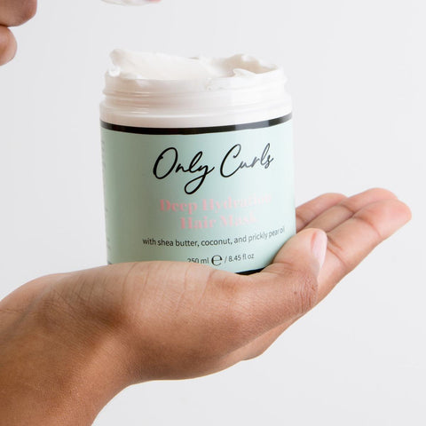 Only Curls Deep Hydration Hair Mask in hand