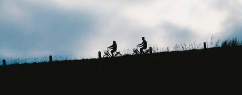 couple-riding-bikes