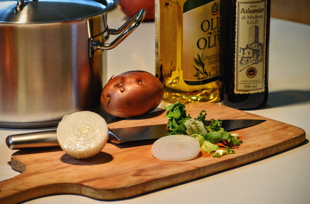 Knife sharpening stone: a knife and ingredients on a cutting board