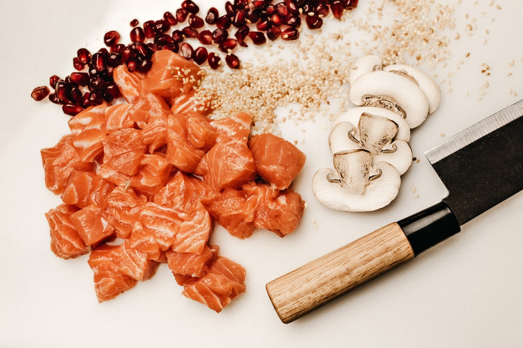 Japanese kitchen knives: a nakiri surrounded by ingredients cut for sushi