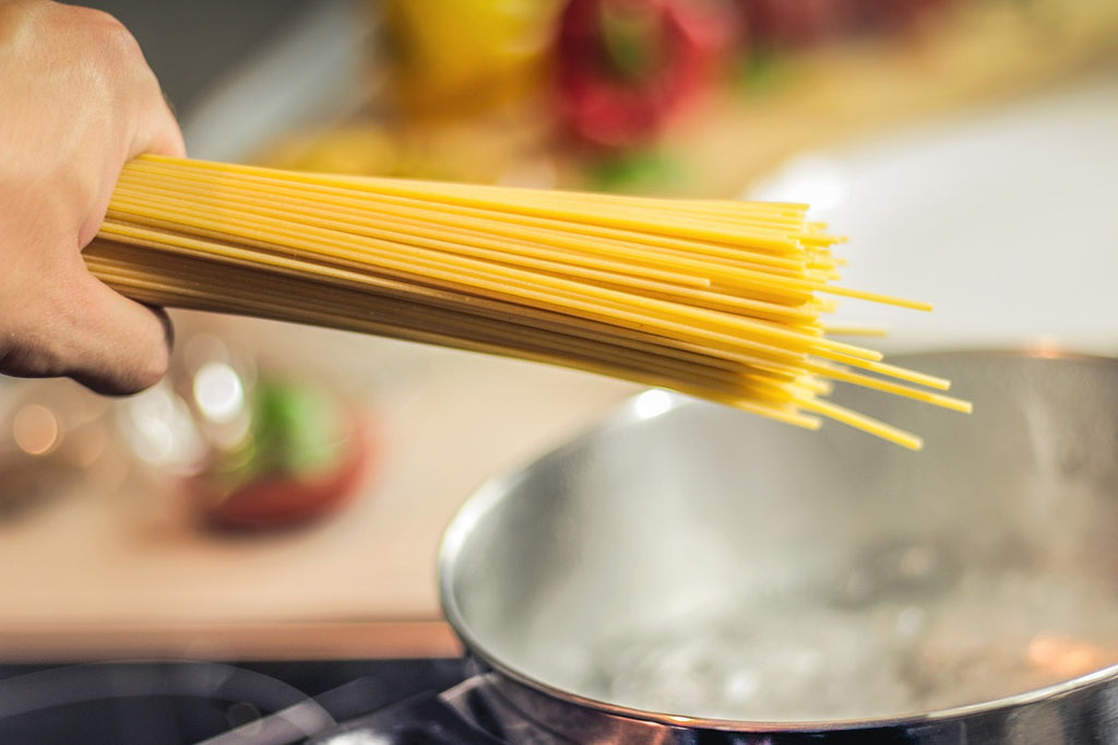 Cooking with stainless steel: pasta goes into a stainless steel pot