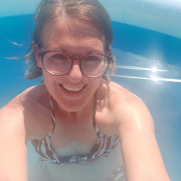 In pool in bikini sun shining