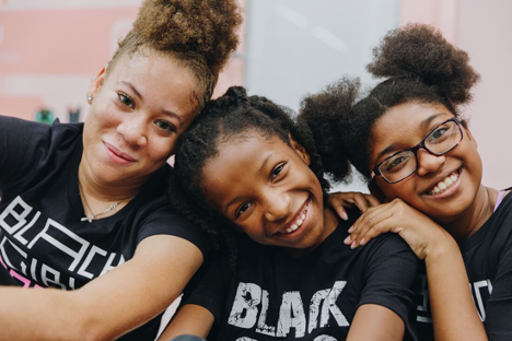 Photo Black Girls Code three young girls who are learning technology