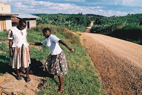 Two Girls in Dresses playing in Uganda Coffee Farm