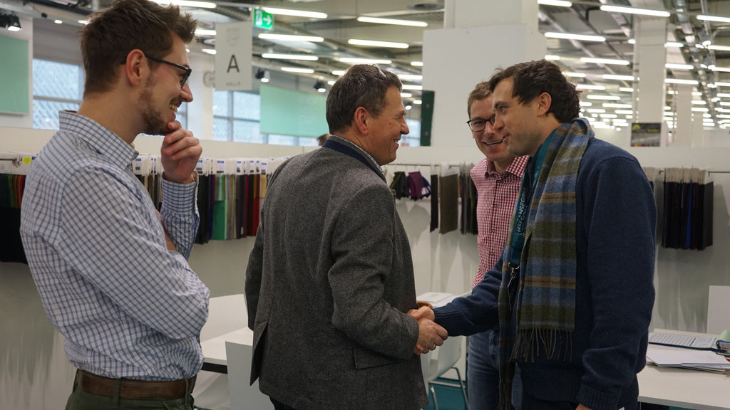 Robert W. Stolz shaking hands with Paulus Mehler from Gebrüder Mehler at the Munich Fabric Start textile show