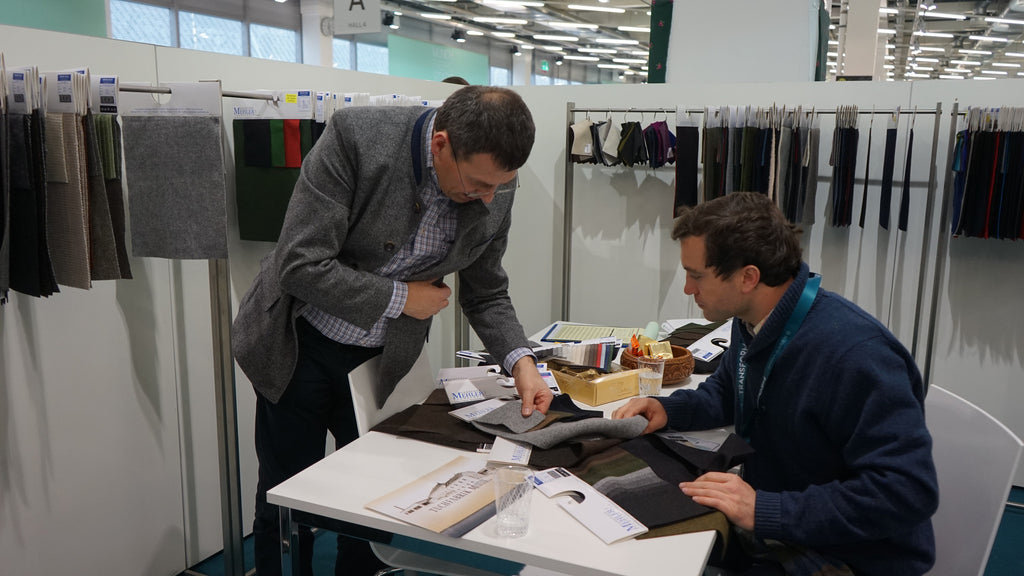 Robert W. Stolz inspecting 100% Wool Loden samples from tuchfabrik Mehler