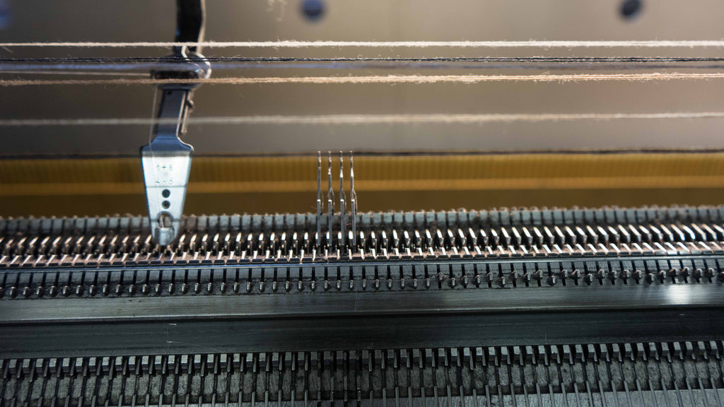 knitting machine with threads