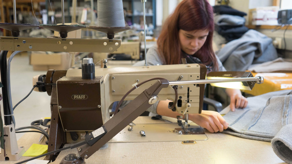 woman sewing a wool jacket